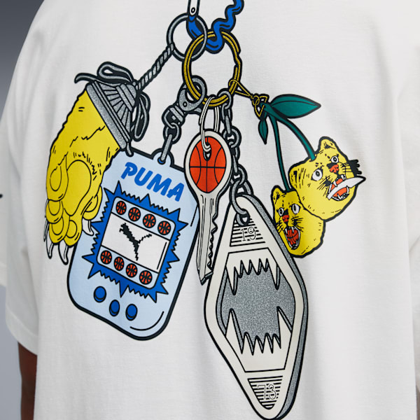 Close-up of a white t-shirt with a colourful keyring print design on the back.