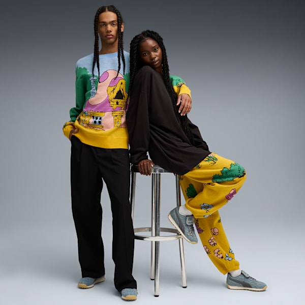 Two models pose against a grey backdrop, showcasing colourful patterned clothing.