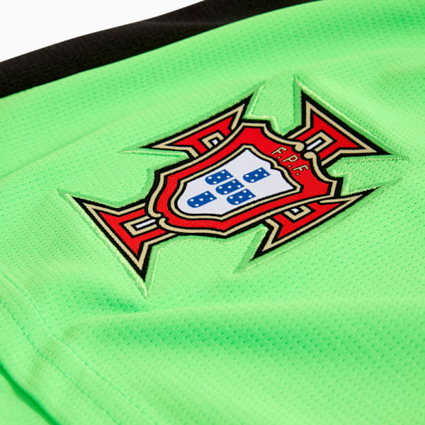 Green PUMA jersey shows the Portugal badge embroidered on the chest.