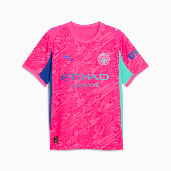 Pink PUMA football shirt, young age group, with blue and turquoise accents and team logos.