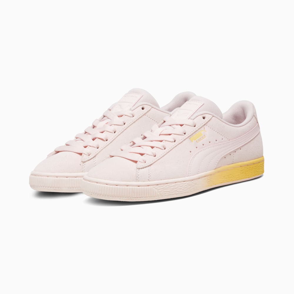 Pink top suede pumas
