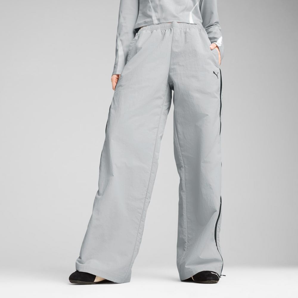 Изображение Puma Брюки DARE TO Relaxed Woven Zip-Off Pants Women #1: Flat Light Gray