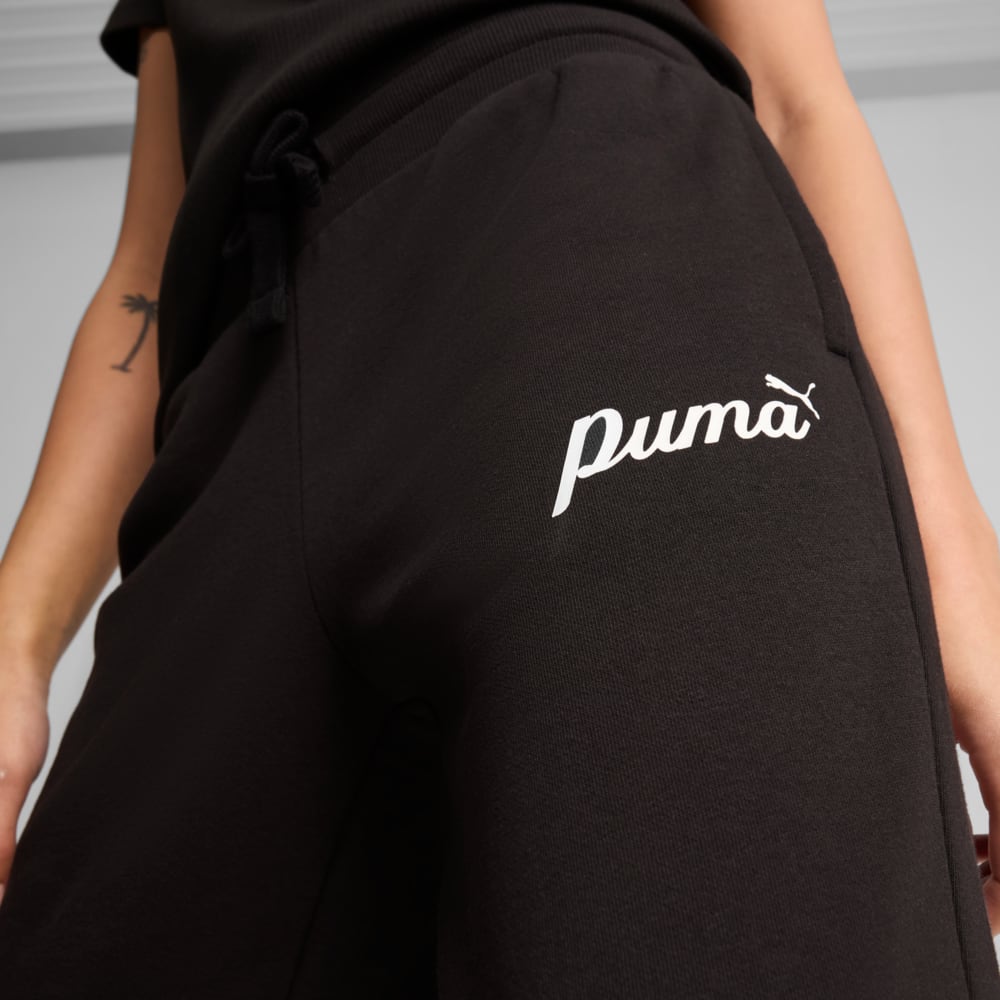 Изображение Puma Брюки ESS+ Script Pants Women #2: Puma Black-Gold foil