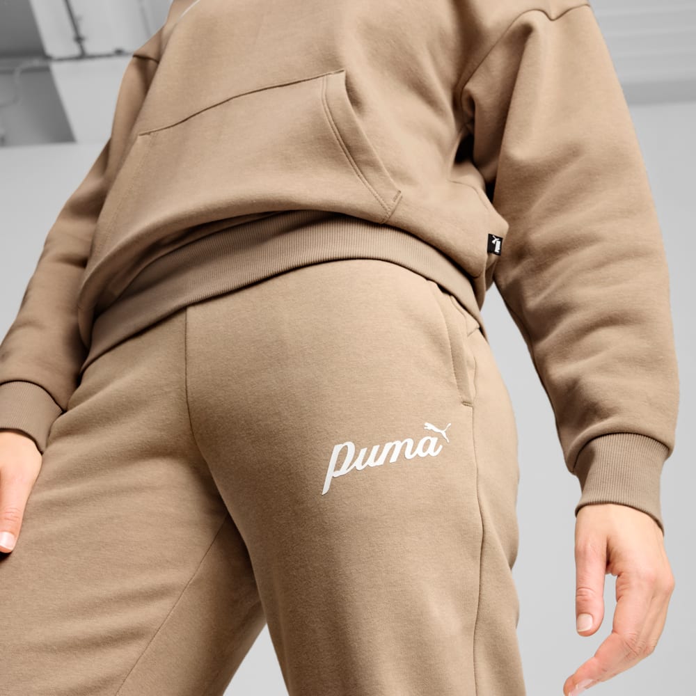 Зображення Puma Штани ESS+ Script Pants Women #2: Oak Branch-White Rubber