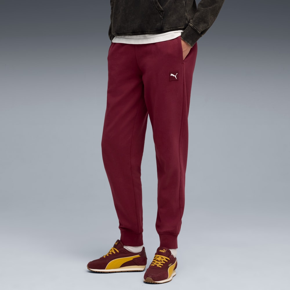 Зображення Puma Штани Essentials Elevated Sweatpants Women #1: Ruby Shimmer