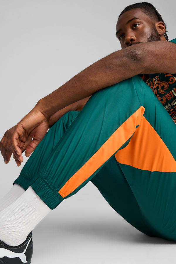 Ivory Coast 2025 Pre-match Woven Pants Men, Dark Myrtle-Rickie Orange, extralarge