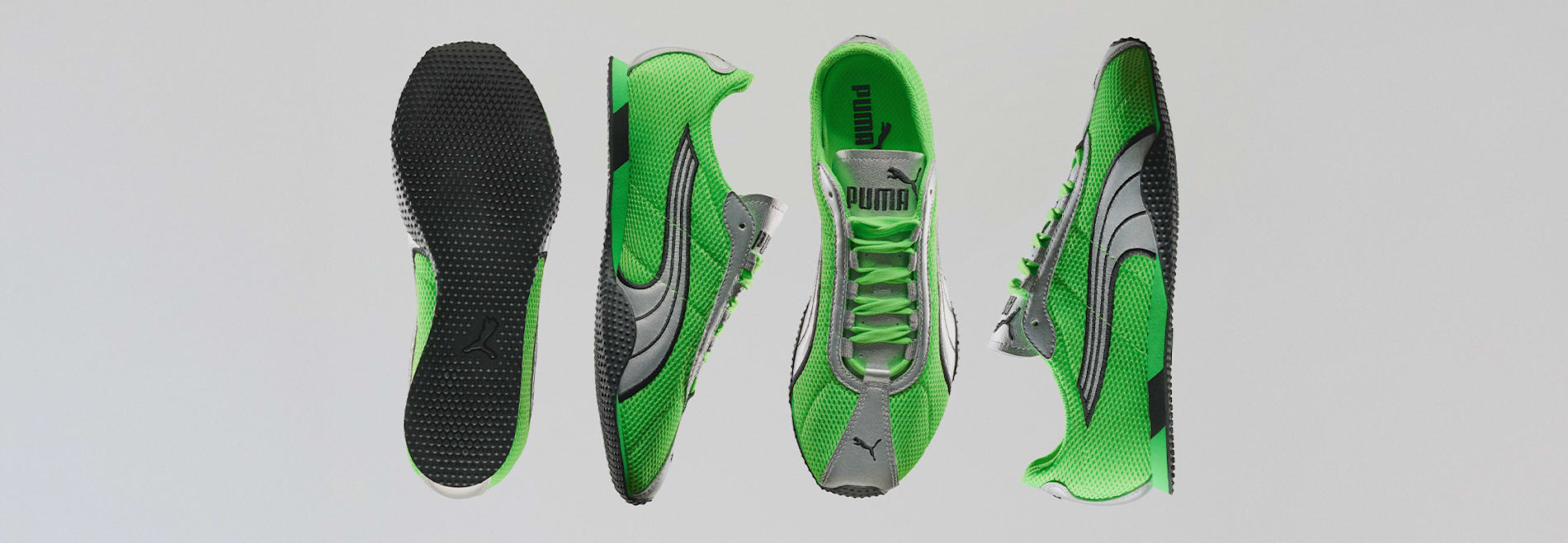 On a light background, four green and silver Puma trainers are displayed from different angles.