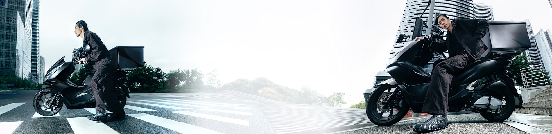 Two models in dark outfits pose on scooters in an urban and natural setting.
