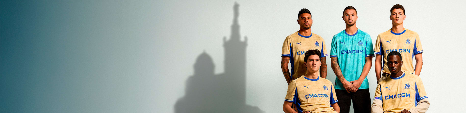 Five models pose in Olympique de Marseille shirts against a plain white backdrop.