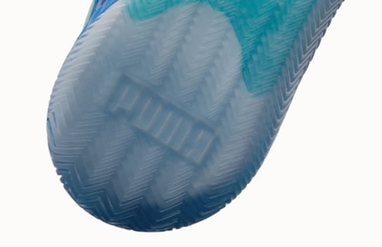 Close-up shows the sole of a light blue and white shoe with the brand's name.