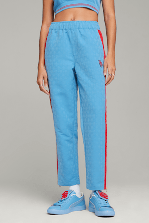 https://images.puma.com/image/upload/t_vertical_model,w_300/global/622699/27/mod01/fnd/PNA/fmt/png/PUMA-x-DAPPER-DAN-Women's-T7-Track-Pants