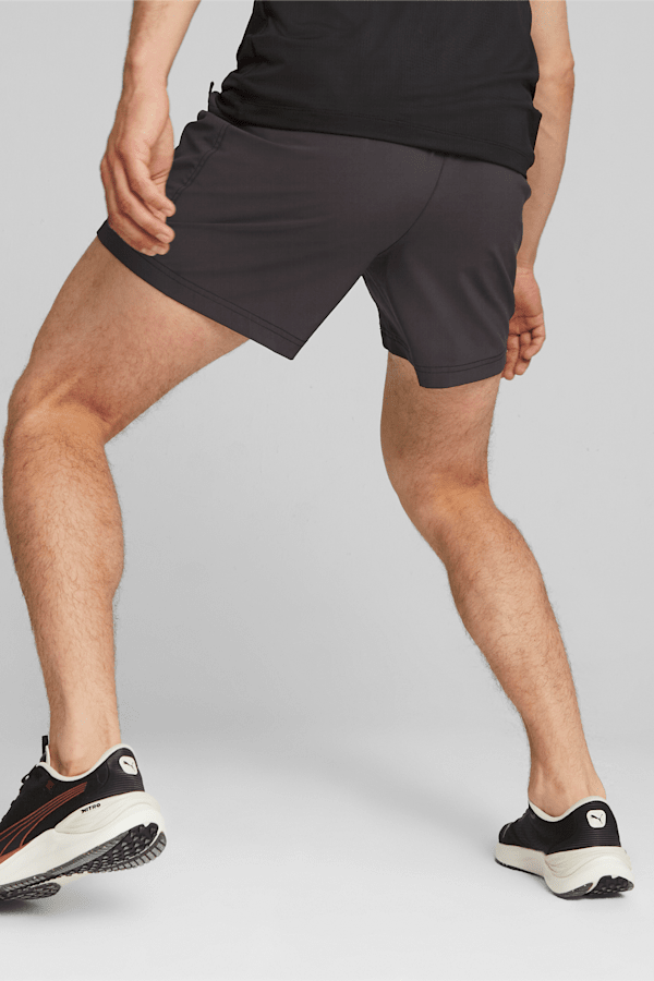 https://images.puma.com/image/upload/t_vertical_model,w_600/global/523919/01/mod03/fnd/PNA/fmt/png/PUMA-x-FIRST-MILE-Men's-5%22-Running-Shorts