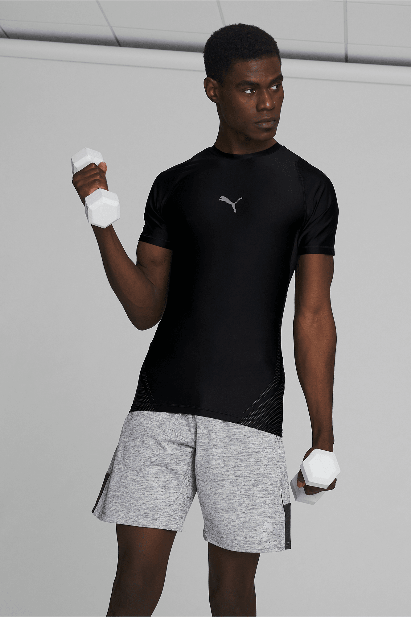 https://images.puma.com/image/upload/t_vertical_model/global/520104/01/mod01/fnd/PNA/fmt/png/EXO-ADAPT-Men's-Training-Tee